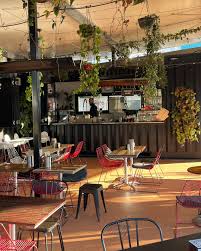 Tables under the hanging plants